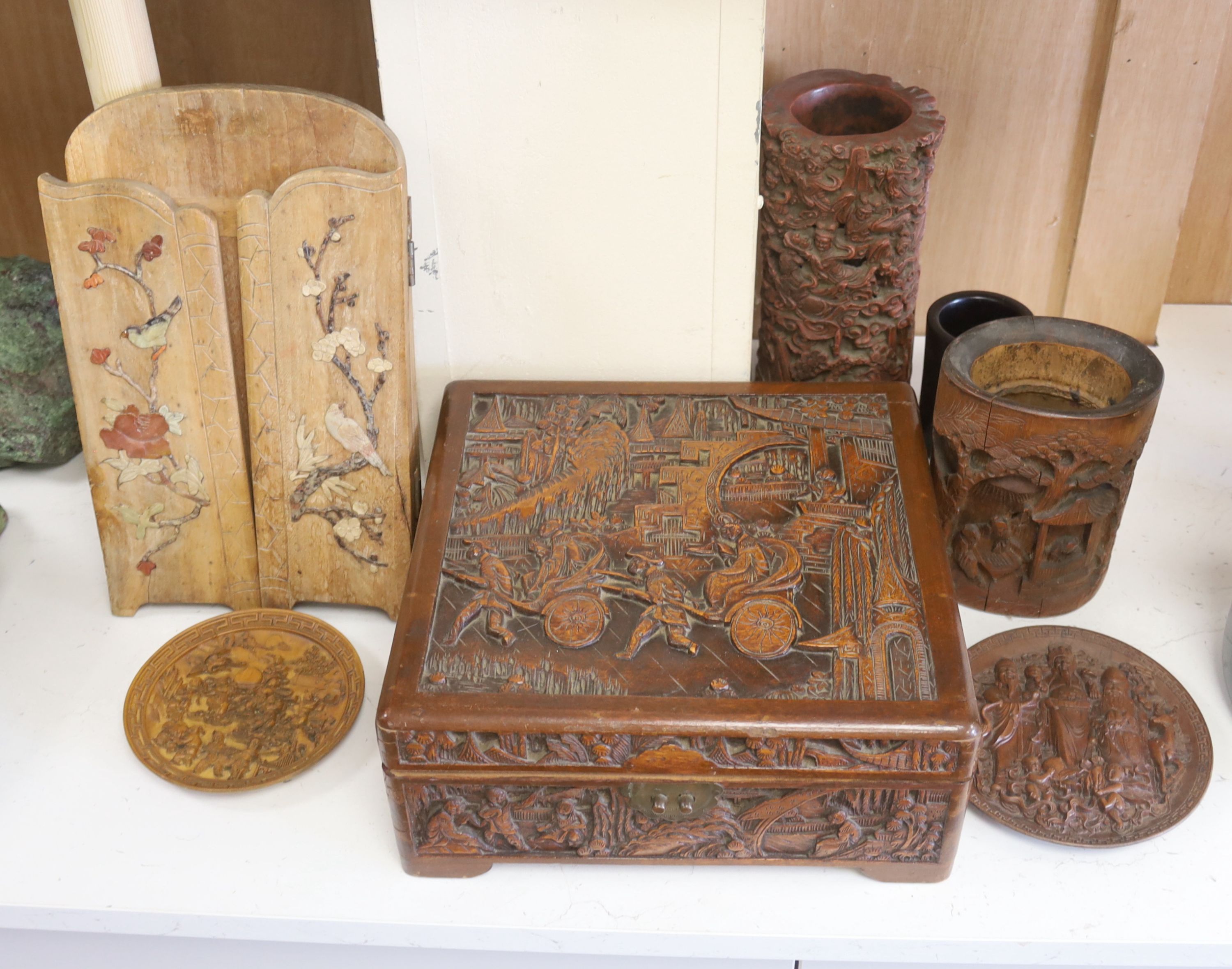 A quantity of 20th century Chinese carved bamboo and wooden effects to include a large brush pot, 17cm high (7)